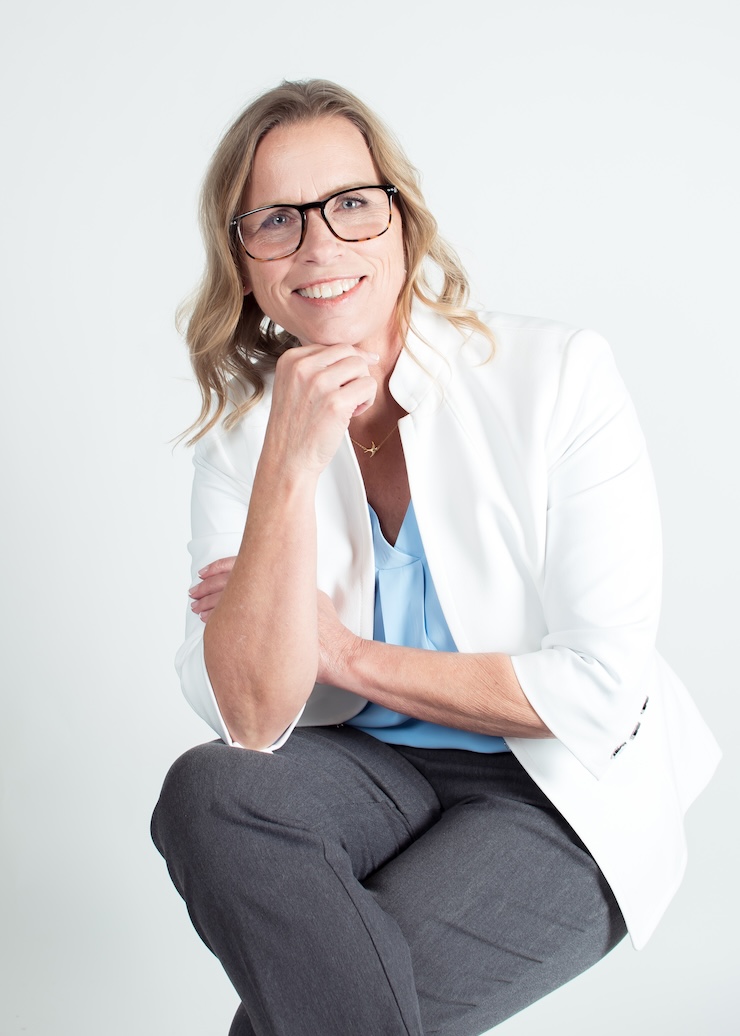 Julie seated on a chair